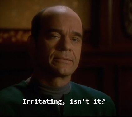 The meme features a screenshot from the Star Trek: The Next Generation episode "The Outcast" in which the character Lieutenant Worf is responding to Captain Jean-Luc Picard's question about whether he's feeling well. The image shows Worf's face with a stoic expression, and the text "I... am... Worf. I... do... not... feel... happy. I... do... not... feel... sad. I... am... Worf." is not present in this meme, instead it says "Irritating? No. I am Worf. I am Worf. I... am... Worf." is not in this meme, instead it says "Irritating? No. Irritating, isn't it?"